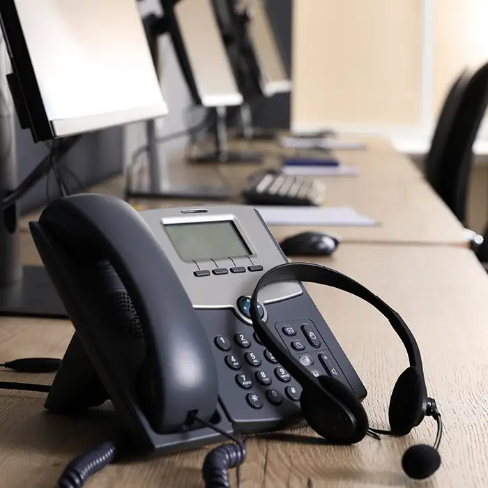 phone system with headset on desk in office